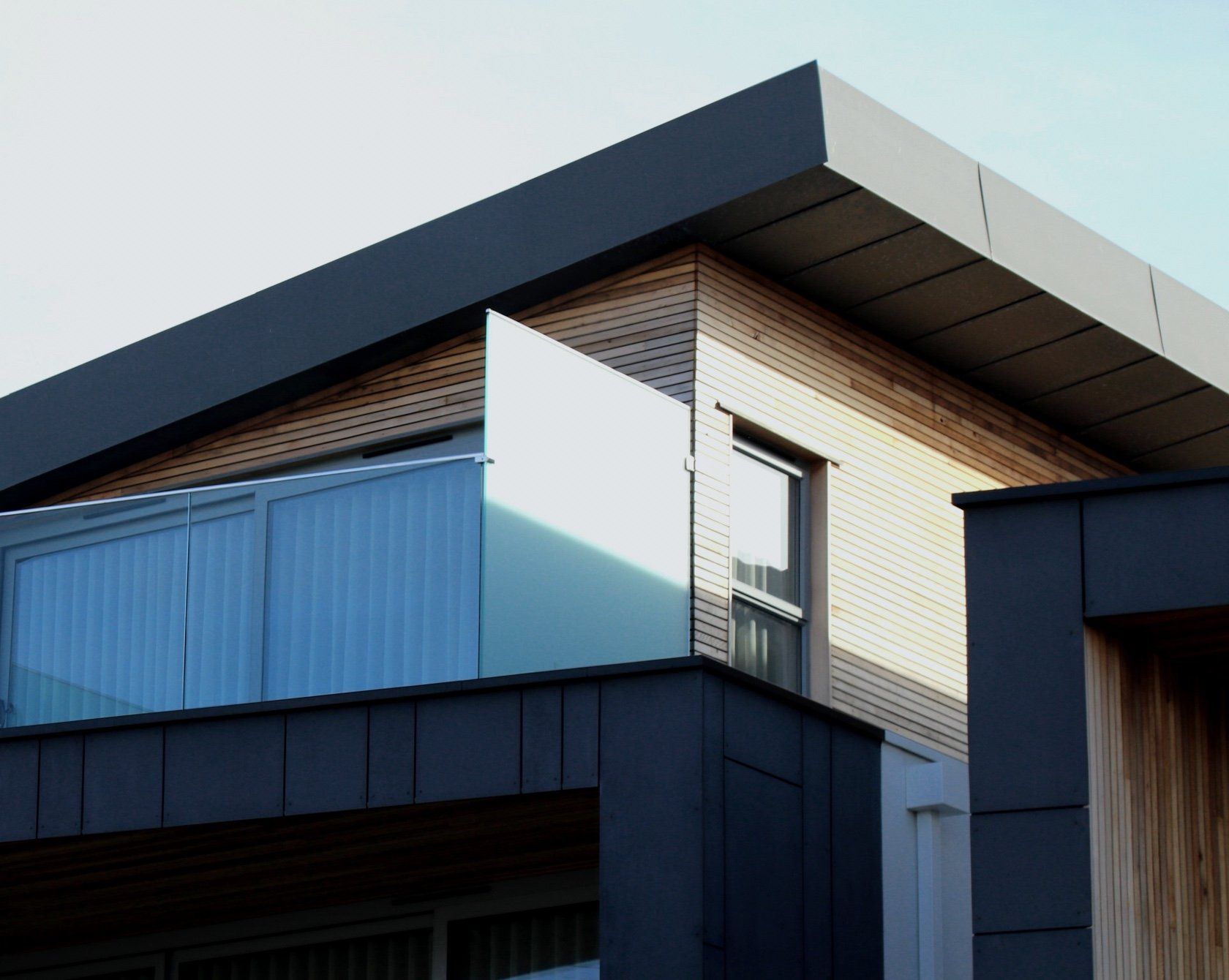A house with a balcony on the side of it